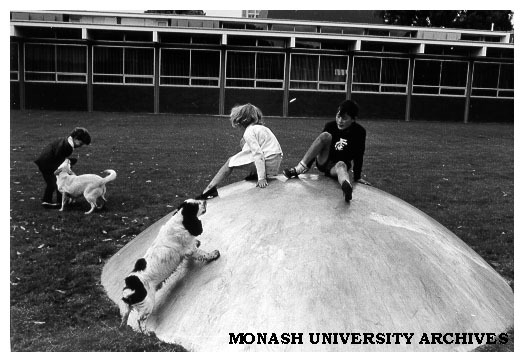Children playing in Science courtyard on one of Clive Murray-White's 'Domes'.