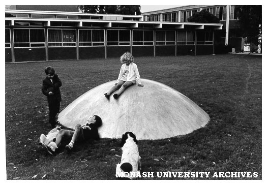 Children playing in Science courtyard on one of Clive Murray-White's 'Domes'.