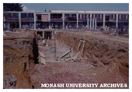 Early construction of Physics building with central Science block in background