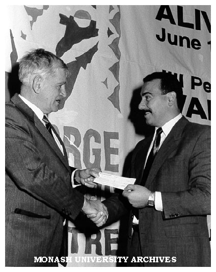 Deputy Vice-Chancellor Professor Geoff Vaughan (left) accepting cheques from Mr Peter Manachetti, Store Manager, Myer Frankston, at inaugural theatre season at George Jenkins Theatre, Frankston campus