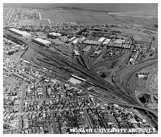 Aerial view of Newport railway workshops with Williamstown Rifle Range in background and Williamstown Cemetery in middleground (one of the very few sited on basalt)