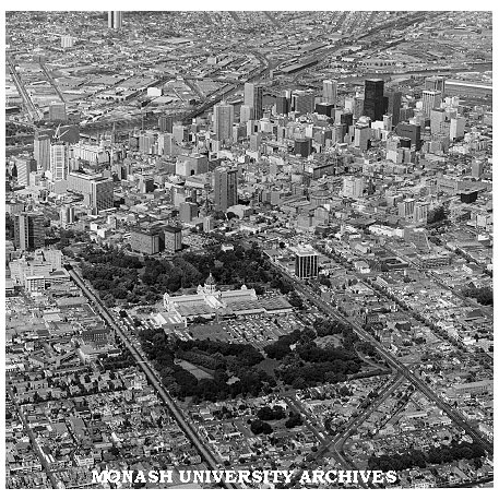 Aerial view of Melbourne CBD from over Fitzroy with Exhibition Building in foreground
