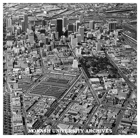Aerial view of western end of Melbourne CBD with Victoria Market and Flagstaff Gardens in foreground