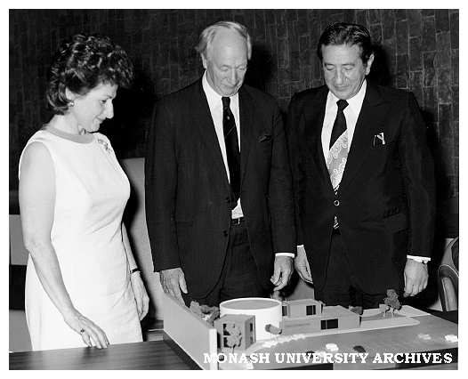 Chancellor Sir Douglas Menzies (centre) presenting model of proposed Krongold Centre to Dinah and Henry Krongold