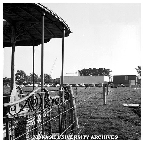 Physics building and lecture theatre with Talbot Colony tram in foreground