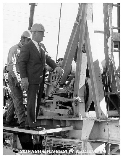 Site of Project A and B, Caulfield Institute of Technology. Director Mr Hartley Halstead lends a hand during preparation of the site