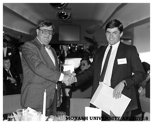 John Taaff (left) presenting the Point of Purchase Media Award to John Dawson