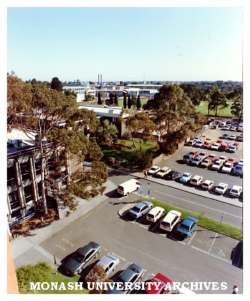 Raised view of University Offices and car park with Vera Moore garden