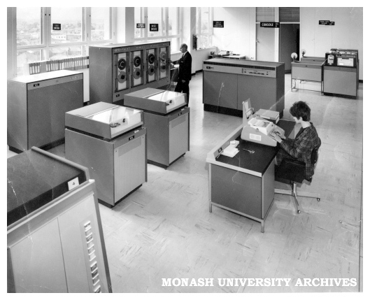 Caulfield Institute of Technology Computer Centre. Console operator Mrs M. Ballantyne and Mr Ray Newland working at the ICL 1903A installation.