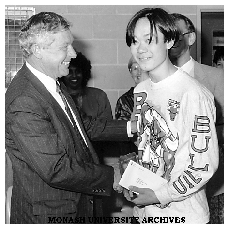 Acting Vice-Chancellor Professor Robert Porter presents the Monash Prize to Mr Quynh (Peter) Vien, Year 11 student at Westall Secondary College, South Clayton
