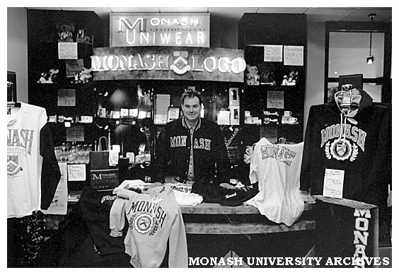 Union retailer controller, Mr Murray Pearce, shows some of the Monash clothing range in the Monash Shop at Clayton