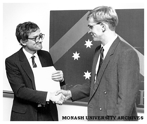 Dean of Engineering Professor Peter Darvall (left) presents the Ian Langlands medal to Mr Lindsay White, top student in the Faculty of Engineering in 1991