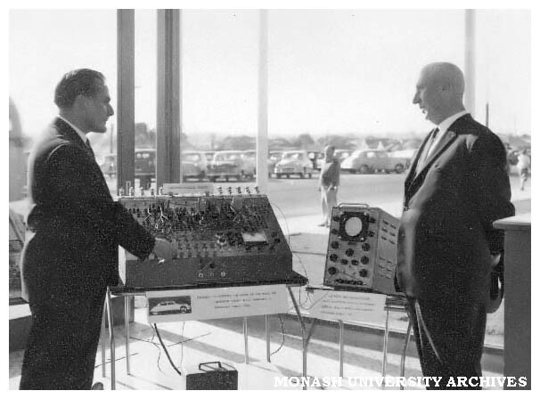 Electronic display at Commonwealth Technical Training Week exhibition at Chadstone shopping centre. D. Mills (left) and Mark Beresford.