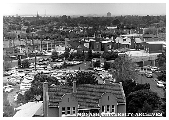 Parking area at Chisholm's Caulfield campus, showing part of Caulfield Plaza and railway