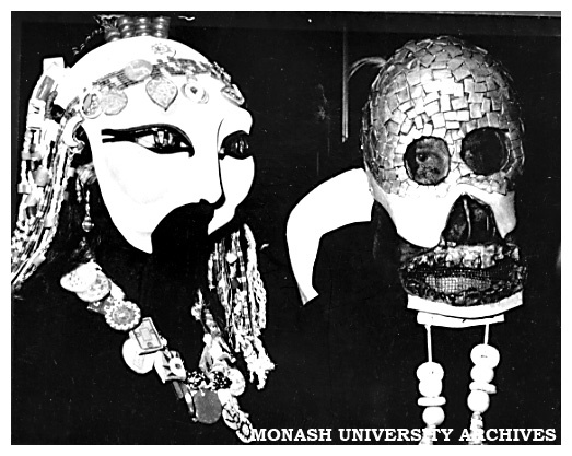 Two masked dancers at the opening of the ceramics installation The Changing Environment at the State Bank Galleria