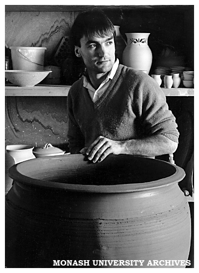 Chisholm Ceramic Design student Martin Gill with one of 12 giant ceramic planters he made on commission