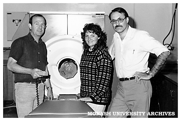 Dr John Davis and Dr Peter Wells of Chisholm Applied Physics Department with Masters student Ms Pam Shadbolt and the CATscan they use for structural analysis of building materials and fossils