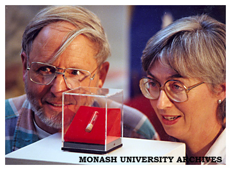 Husband and wife paleontologists Dr Tom Rich, Museum of Victoria, and Professor Pat Vickers-Rich, director of Monash University Science Centre, observe the jawbone fossil of Ausktribosphenos nyktos