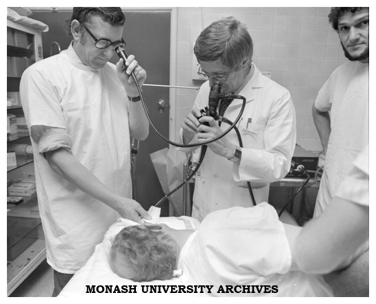 Dr Jack Hansky (right) uses an endoscope to examine a duodenal ulcer with Dr Graham Schmidt (centre)