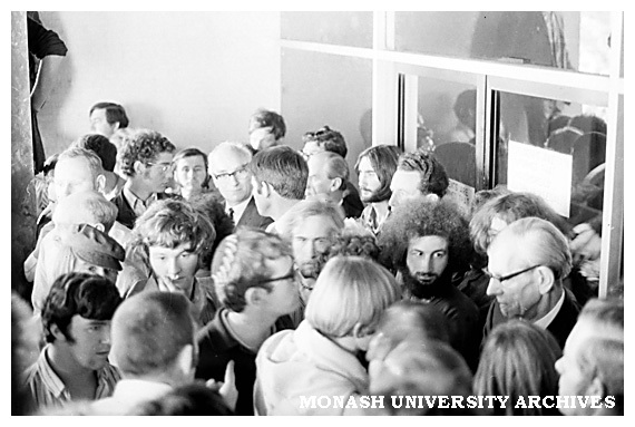 Student protesters confront Vice-Chancellor Matheson in Administration building.