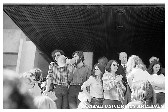 Mr Johnson (Comptroller) and Vice-Chancellor Matheson (obscured rear right) with protesting students on steps of Administration building