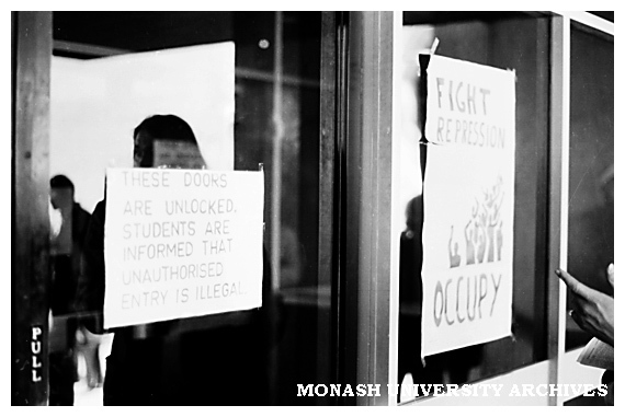 Student protest signs on Administration building doors