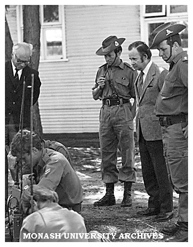 Vice-Chancellor Matheson (left), Lt. Col. Lockwood, Pro Vice-Chancellor Scott and Lt. Tucker watching a signals lesson at Monash University Regiment Camp, Benalla