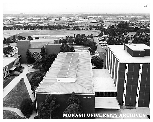 Raised view of Main Library and Robert Blackwood Hall with playing fields in the background