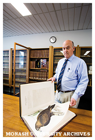 Rare Books Librarian Richard Overell, with a hand-coloured engraving of a wedge-tailed eagle from John Gould's book 'Birds of Australia'