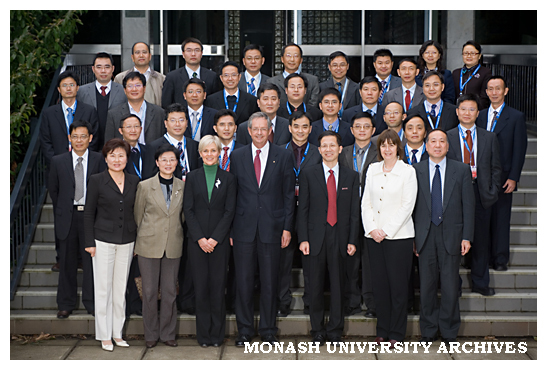 Delegation from Sichuan University, including two vice-presidents and all 35 deans, with Professor Richard Larkins on the steps of the Administration building