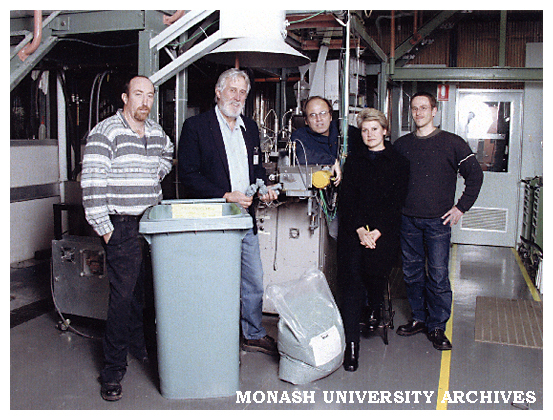 Materials Engineering research fellows and staff with newly developed garbage bin, created from post-consumer bottle grade HDPE.