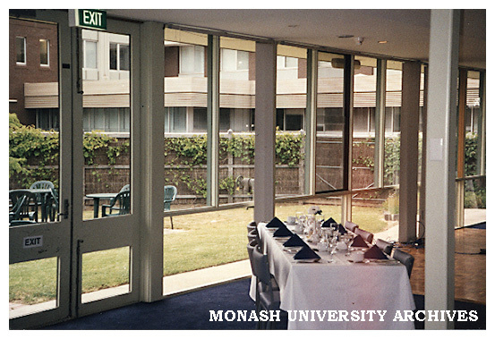 Interior of Monash University Club with outdoor eating area and Building 3d in background