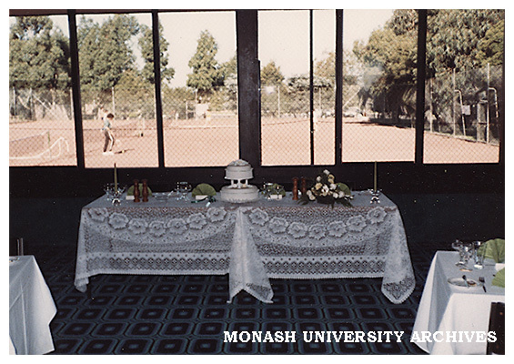 Interior of Monash University Club with tennis courts in background