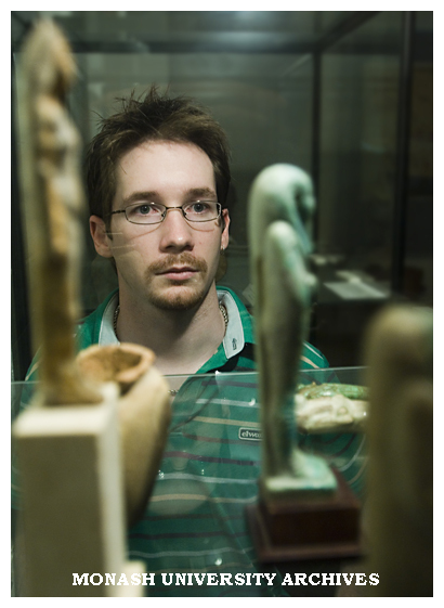 Archaeology honours student Daniel James, inaugural Homer Le Grand scholarship winner, with Egyptian Ushabti figure of Pa-Abu-Mekh.