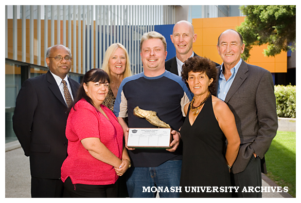 Winners of the 2005 Global Corporate Challenge Dr Bala Balanchandran (left), Ms. Lorraine Foxall, Dr Jill Grogan, Mr Peter Lausch, Mr. Martin Doulton, Ms. Rosemary Demirtas with Mr. Herb Elliott.