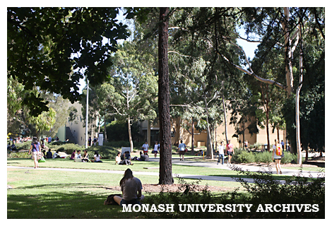 Students in grounds of Clayton campus, with Campus Centre in background