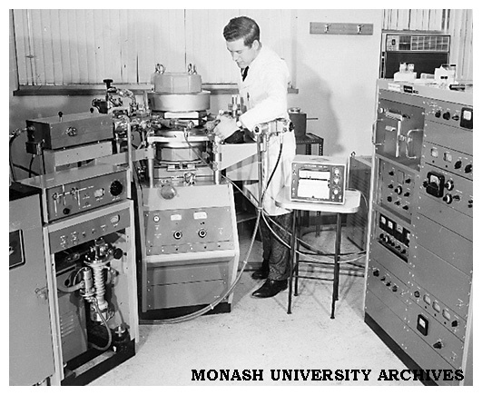 Dr Bryan Gatehouse with first mass spectrometer in Department of Chemistry