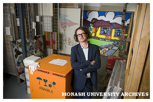Max Delaney, Director of Monash University Museum of Art (MUMA), with some of the art works from the University's collection of contemporary art in the store room at Clayton Campus.