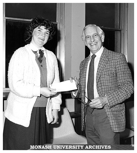 Rozlyn Gaffney, secretary of MUMCO, accepts the Garnet H. Carroll award from Professor John Legge