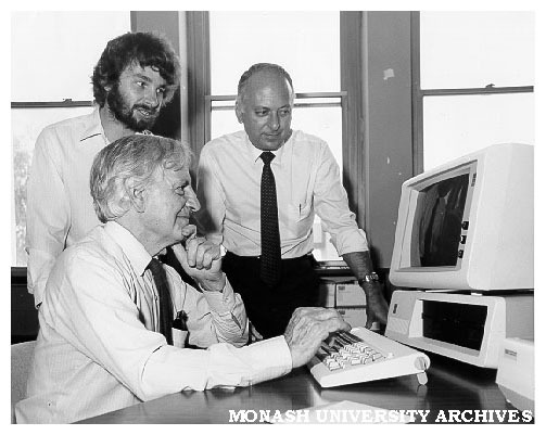 Computer training, Professor John Legge (seated), Mike Manning (left) of Arts faculty's computer training program, and Peter Slaney from IBM
