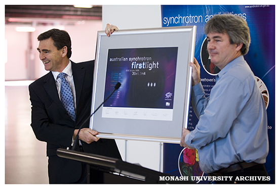Greg LeBlanc, Lead Accelerator Physicist at the Australian Synchrotron, with the Honourable John Brumby, Minister for Innovation (left), announcing the achievement of first light
