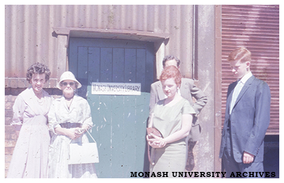 Myrtle Spottiswood, Kathleen Thomson, Anne Frazer, David Darling and Murray Frazer outside the Monash University Library in the Volkswagon factory