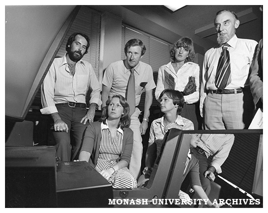 Lindsay Martin (far left) of the Education Development Centre demonstrates the use of a large screen projector at an open day for teachers from schools in Melbourne's southern suburbs
