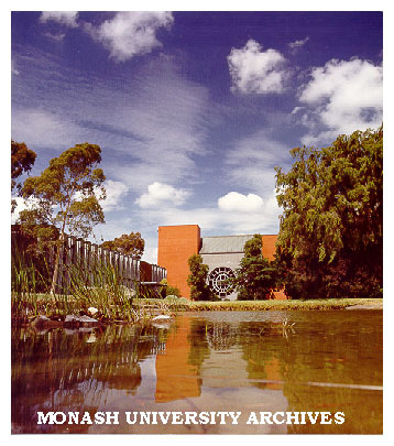 Robert Blackwood Hall, University Offices to the left, pond in foreground