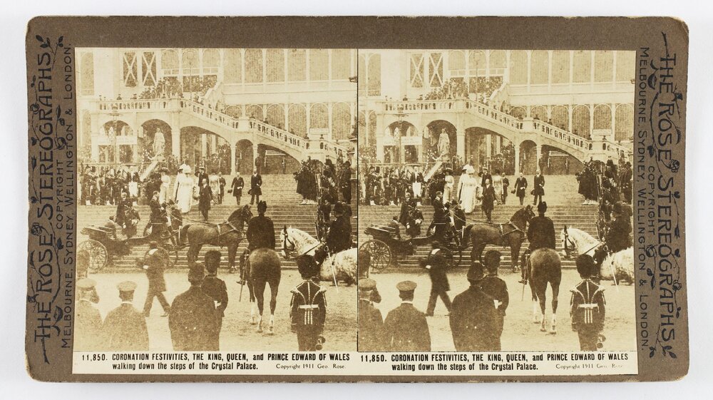 Coronation Festivities. The King, Queen, and Prince Edward of Wales walking fown the steps of the Crystal Palace