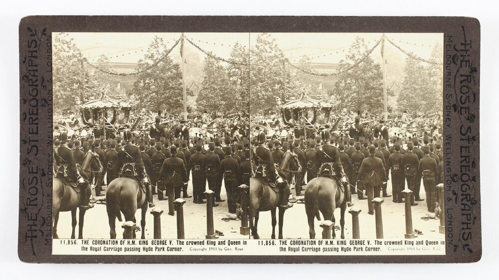 The Coronation of H.M. King George V. The crowned King and Queen in the royal carriage passing Hyde Park corner