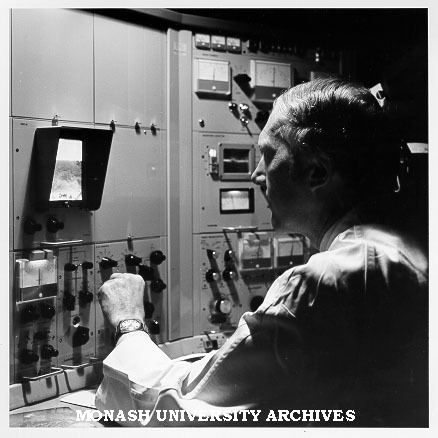 Associate Professor Eric Glasgow using scanning electron microscope