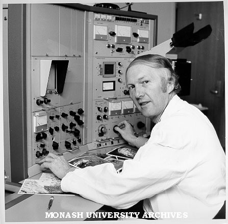 Associate Professor Eric Glasgow using scanning electron microscope