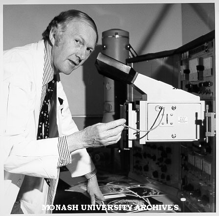 Associate Professor Eric Glasgow using scanning electron microscope