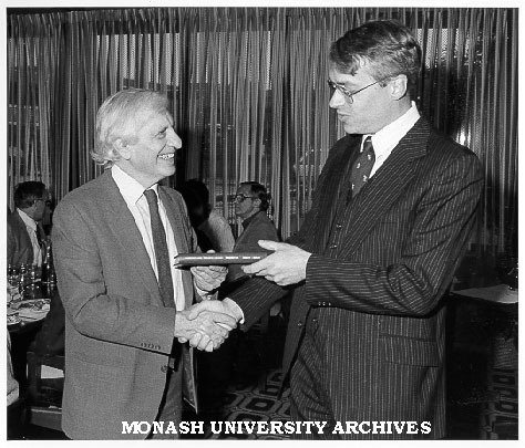 Professor Merle Ricklefs (right) making presentation to Dean of Arts Professor John Legge